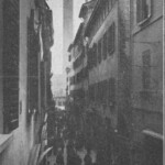 Mercato di Mezzo tra via Spaderie e via Tosapecore (la prima a destra). Immagine e testo tratti dal libro di Angelo Finelli Bologna nel Mille - Identificazione della cerchia che le appartenne a quel tempo, edito a Bologna dagli Stabilimenti Tipografici Riuniti nel 1927.