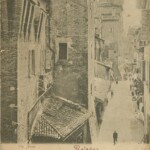 L'antica via delle Asse (oggi via IV Novembre), con le botteghe che ancora erano addossate sul fianco del palazzo Comunale. Accanto a queste botteghe era una edicola, anch'essa addossata al muro del palazzo Comunale, contenente una immagine di Madonna dipinta su asse di cedro, detta "Madonna delle Asse", che diede l'antico nome della via. Questa immagine oggi è custodita nel "Chiostro delle Madonne" presso la Certosa di Bologna,